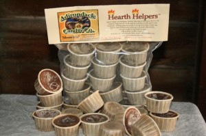Hearth Helpers (TM) are fire starters that are manufactured from left over scented wax, poured into a paper pill cup.  Place one under a dry log or two, light the paper pill cup, then sit back and watch your fire start with no effort.  Click on the picture to order some today.